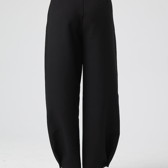 Model wears Black Pants