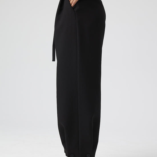 Model wears Black Pants