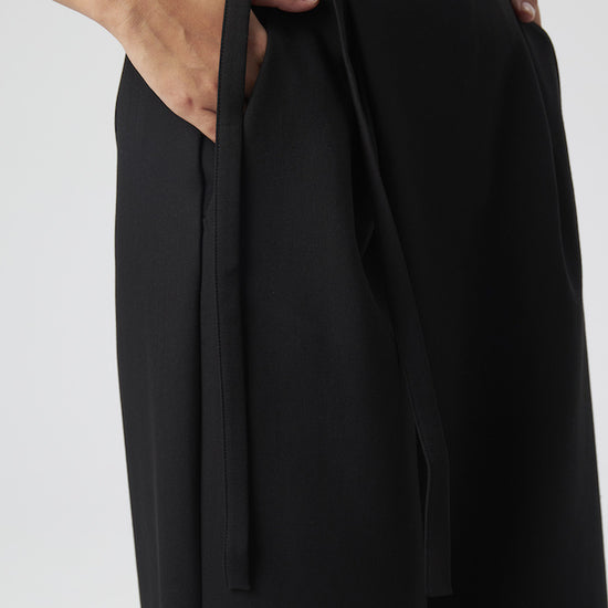 Model wears Black Pants