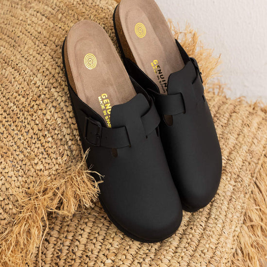 Model wears Riva Black Clogs