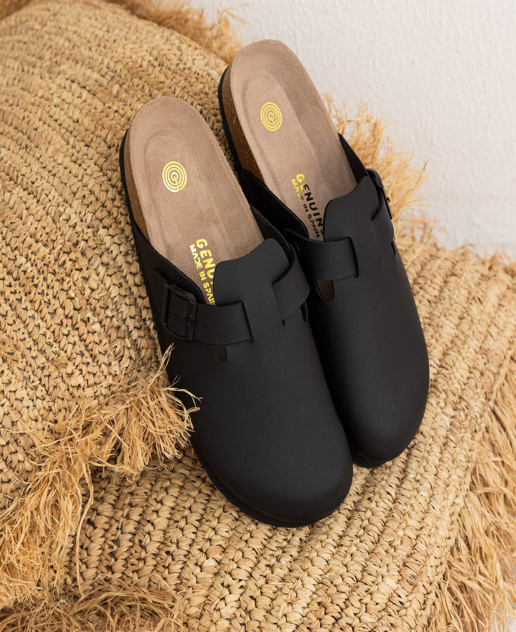 Model wears Riva Black Clogs