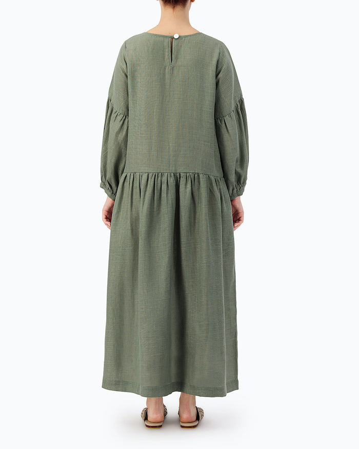 MODEL IS WEARING GREEN LOOSE DRESS- PROJECT 11.1