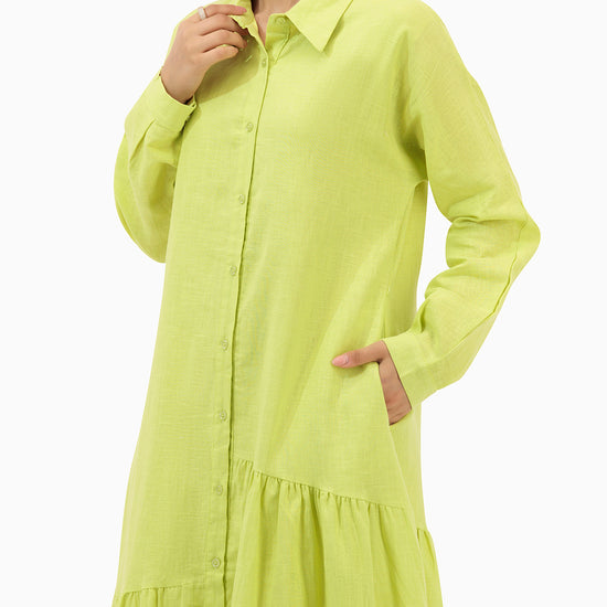 Model wears Green Dress