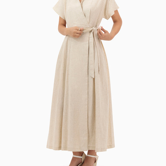 Model wears Beige Wrap Dress