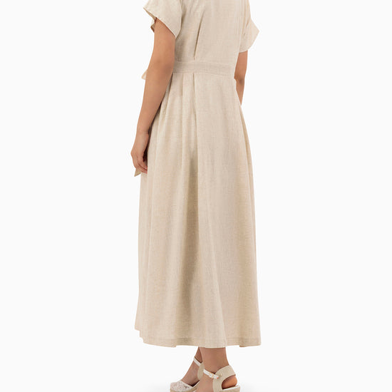 Model wears Beige Wrap Dress