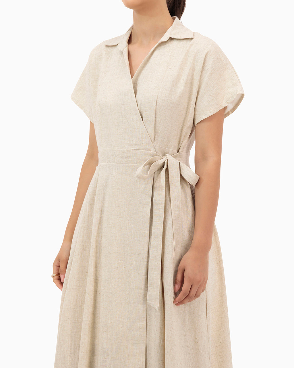 Model wears Beige Wrap Dress