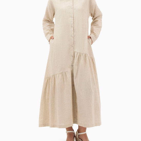 Model wears Beige Dress