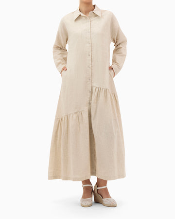 Model wears Beige Dress