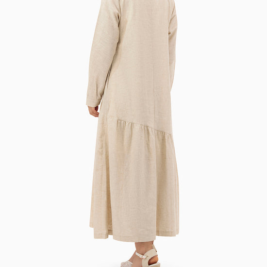 Model wears Beige Dress