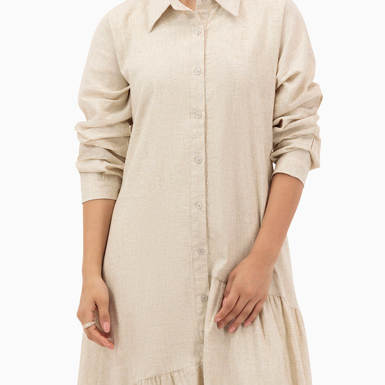 Model wears Beige Dress