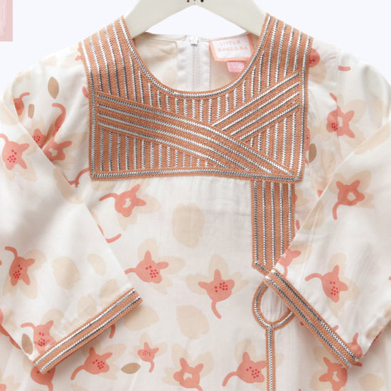 Model wears White and Peach Floral Talli