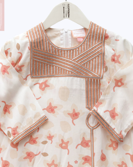 Model wears White and Peach Floral Talli