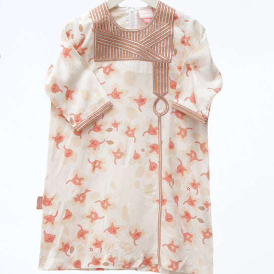 Model wears White and Peach Floral Talli