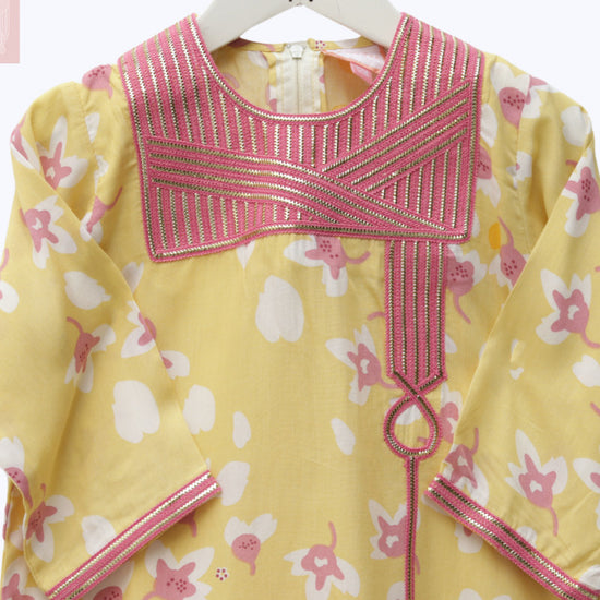 Model wears Yellow And Pink Floral Talli