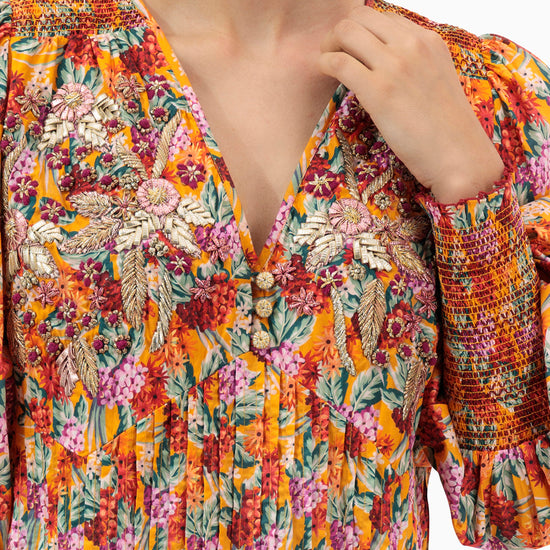 Model wears Orange Pleated Kaftan