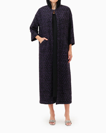 Model wears Purple Abaya