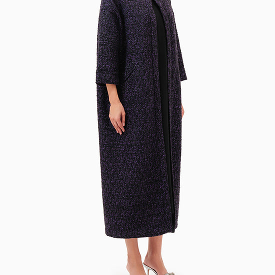 Model wears Purple Abaya