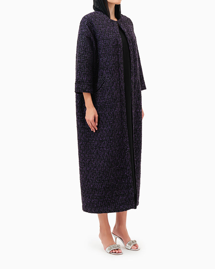 Model wears Purple Abaya