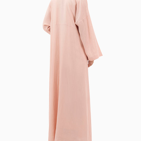 Model wears Peach Linen Abaya