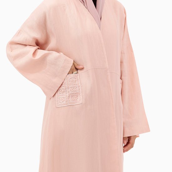 Model wears Peach Linen Abaya