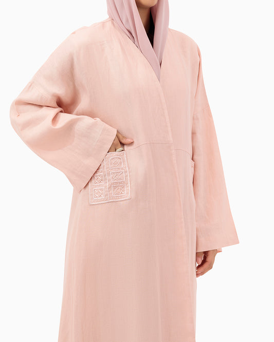 Model wears Peach Linen Abaya