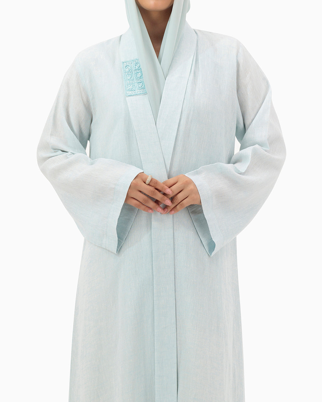 Model wears Pastel Blue Linen Abaya
