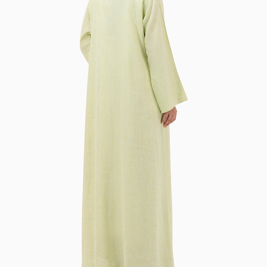 Model wears Pastel Green Linen Abaya