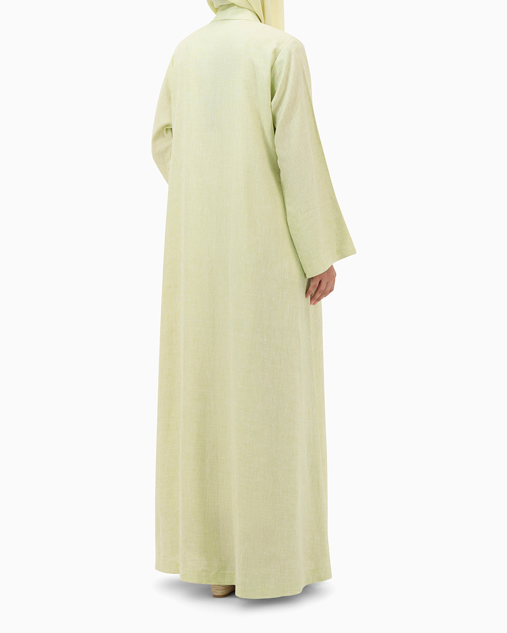 Model wears Pastel Green Linen Abaya