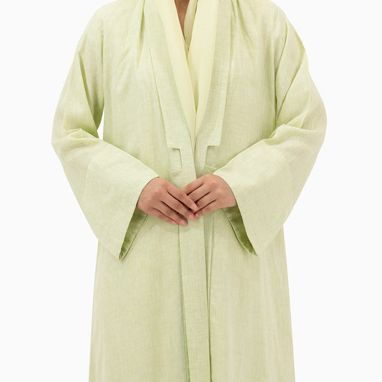 Model wears Pastel Green Linen Abaya