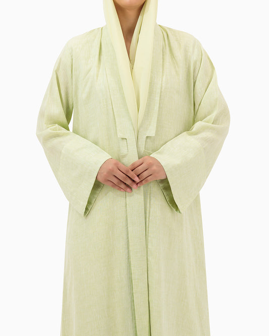 Model wears Pastel Green Linen Abaya